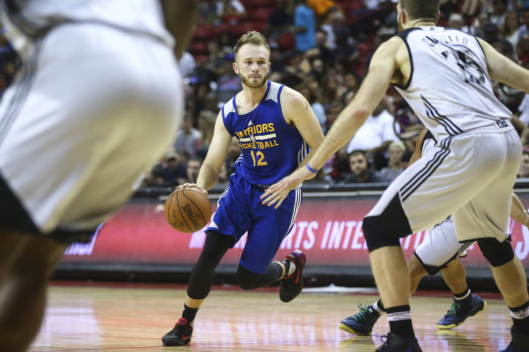 Golden State Warriors' Bryce Alford (12) drives against the Minnesota Timberwolves during a basketball game at the NBA Summer League at the Thomas & Mack Center in Las Vegas on Tuesday, July 1 ...