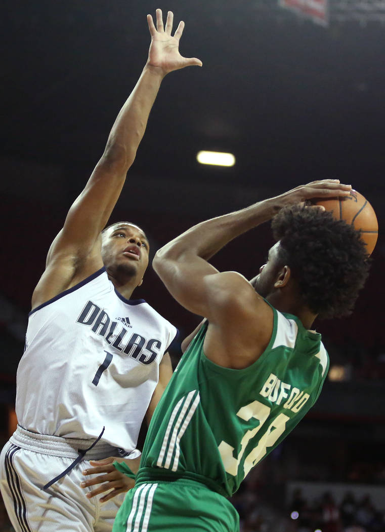 Dallas Mavericks guard Dennis Smith Jr. attempts to block Boston Celtics player Perrin Buford's shot during their 2017 NBA Summer League game at Thomas & Mack in Las Vegas on Saturday, July 15 ...