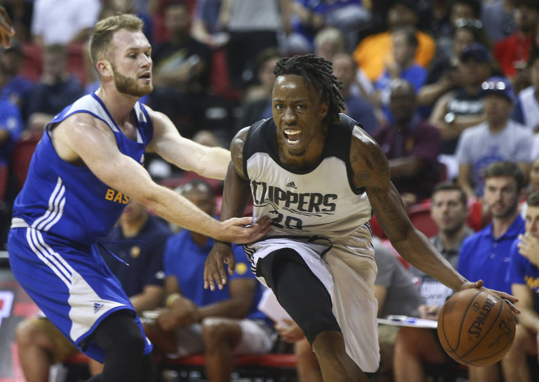 Los Angeles Clippers' Jaron Johnson (28) drives past Golden State Warriors' Bryce Alford (12) during a basketball game at the NBA Summer League at the Thomas & Mack Center in Las Vegas on Fri ...