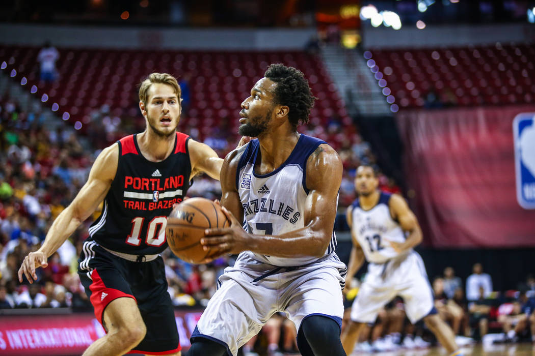 Memphis Grizzlies player Wayne Selden Jr. looks to pass against Portland Trail Blazer forward Jake Layman (10) during the NBA Summer League semifinal basketball game at Thomas and Mack Center on S ...