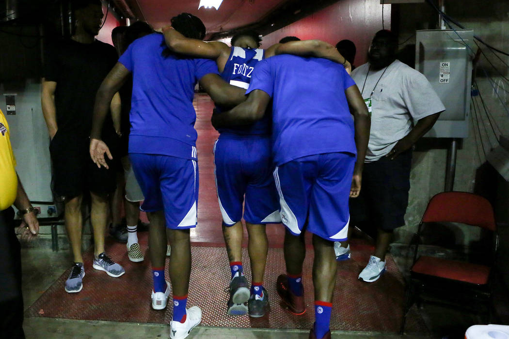 Philadelphia 76ers guard Markelle Fultz is carried off the court by teammates during the 76ers NBA Summer League game against the Golden State Warriors at Thomas and Mack Center in Las V ...