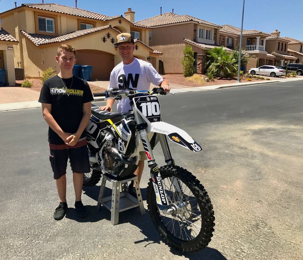 Kyle Kellett (right), 29, used to ride motocross. Now, he's partnered up with Devon Bates, 16, as his mechanic and traveling companion. (Madelyn Reese/View) @MadelynGReese