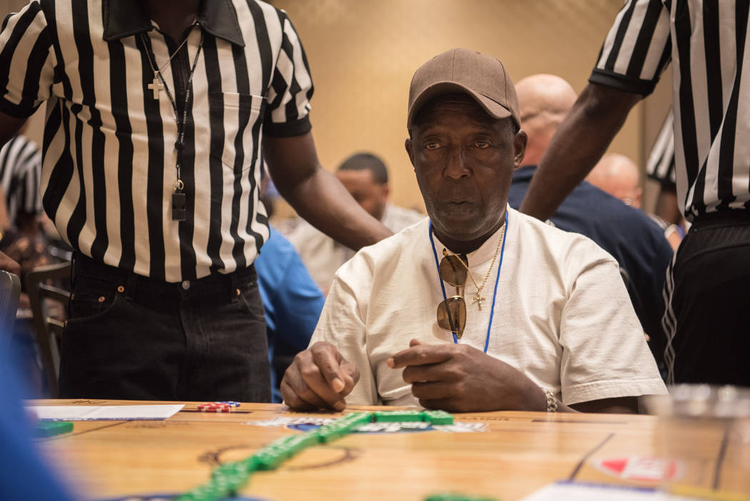 John Brown finishes a game in the first round at the Summer Slam Domino Tournament hosted by the The Universal Domino League at Westgate hotel-casino on Saturday, July 8, 2017, in Las Vegas. Morga ...
