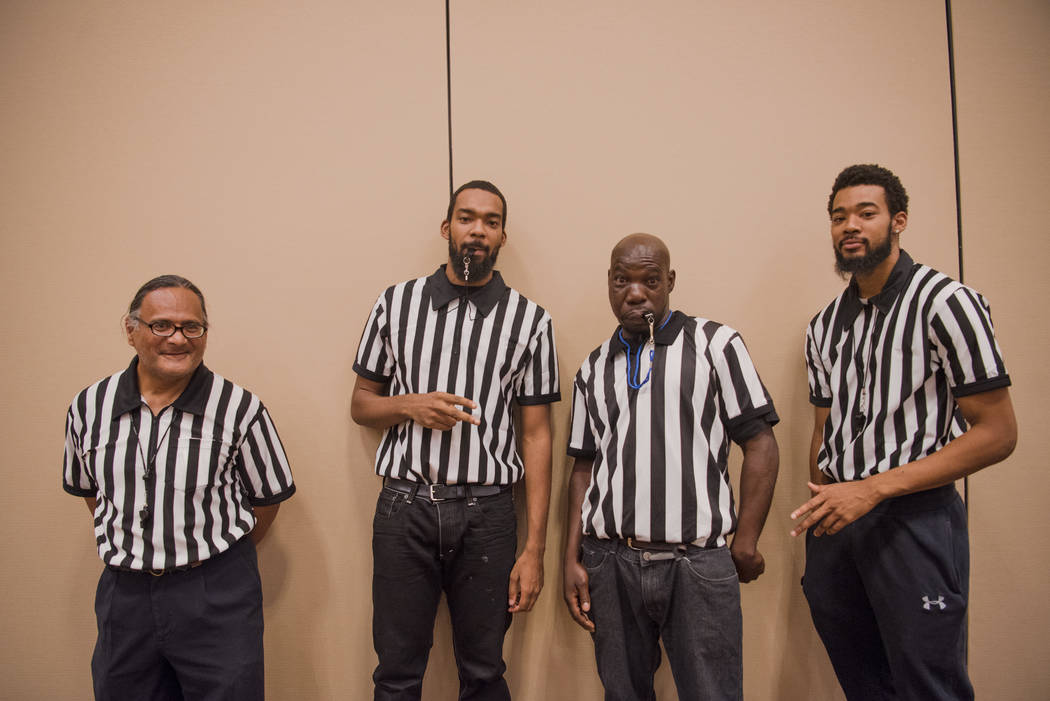 Referrees Don Smiler, left, Devon Neal, Arlin Dwayne Jr. Carroll, and Antonio Neal pose for a portrait at the Summer Slam Domino Tournament hosted by the The Universal Domino League at Westgate ho ...