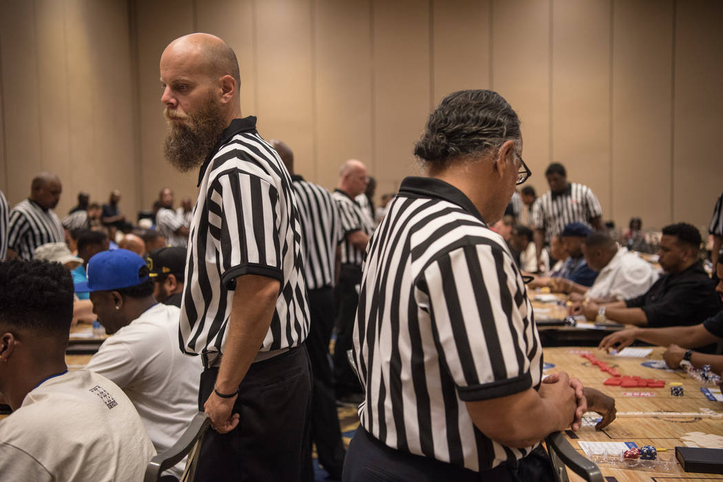 Nick Theodore referees multiple games of dominoes at the Summer Slam Domino Tournament hosted by the The Universal Domino League at Westgate hotel-casino on Saturday, July 8, 2017, in Las Vegas. M ...