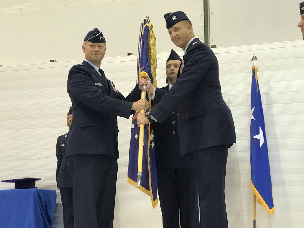 Air Force Lt. Gen. Mark Kelly, left, with Col. Julian Cheater Thursday, July 6, 2017, during a change-of-command ceremony inside the Reaper hangar at Creech Air Force Base, Indian Springs, Nevada. ...
