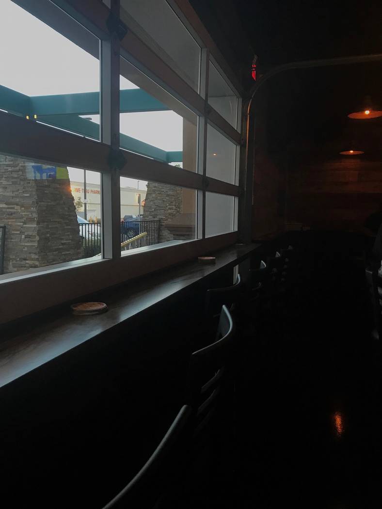 595 Craft and Kitchen offers seating at the bar, booths, several tables, and another row of barstools facing a garage-door style window that opens when the weather is nice. (Madelyn Reese/View) @M ...