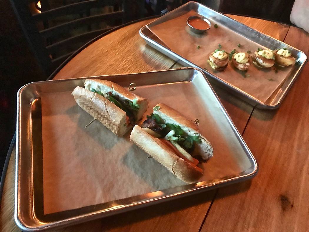 595 Craft and Kitchen offers several types of banh mi including its signature sandwich: (pictured) features honey soy glazed pork, cucumber, pickled daikon, carrot cilantro, jalapeño mayonnaise a ...