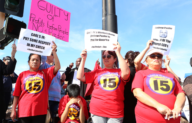 Petrade Santos, left, Irma Calzadillas and Bertha Nabarro joined other workers fighting for a minimum wage protest outside of a Carl's Jr. on 2100 Fremont St., Monday, Feb. 13, 2017, in Las Vegas. ...