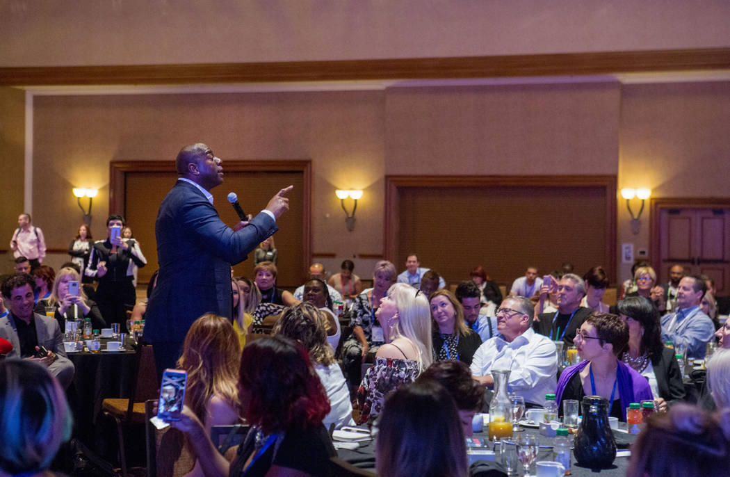 Businessman and former basketball star Earvin "Magic" Johnson delivers the keynote speech for the Professional Beauty Association Business Forum during Cosmoprof North America at ...