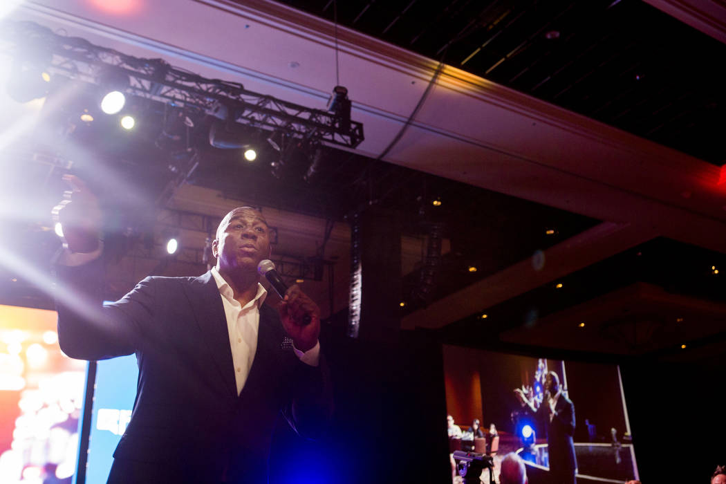 Businessman and former basketball star Earvin &quot;Magic&quot; Johnson delivers the keynote speech for the Professional Beauty Association Business Forum during Cosmoprof North America at ...