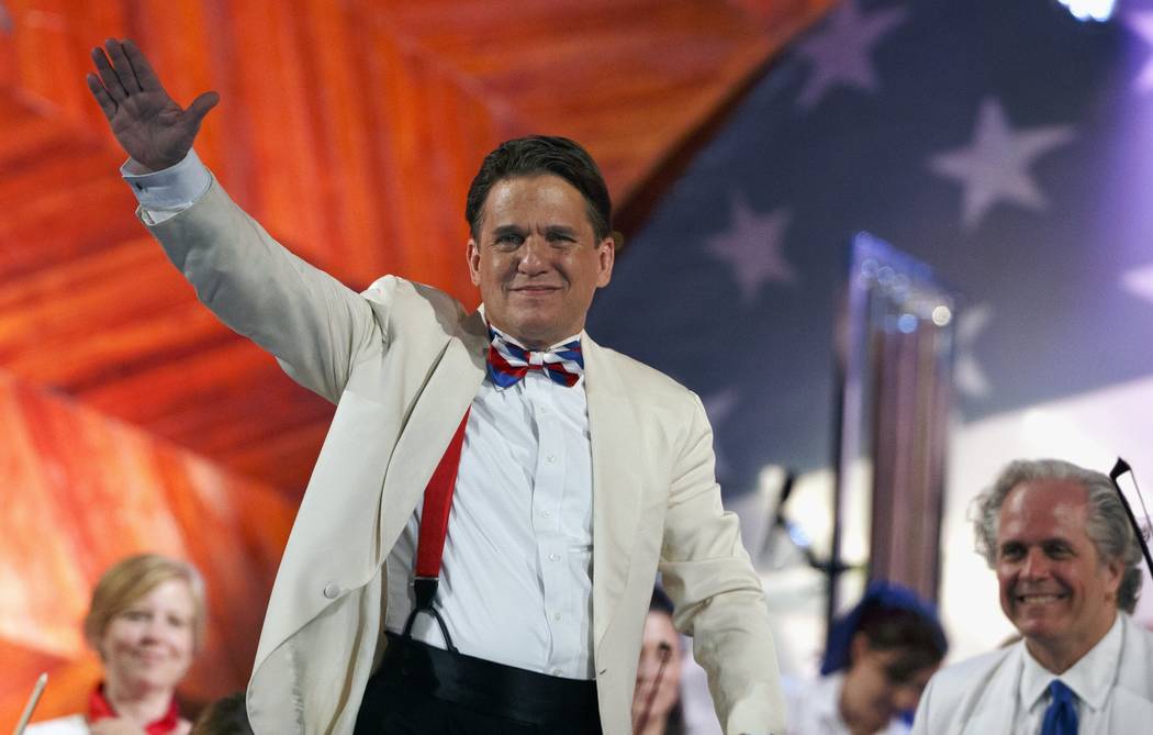 Conductor Keith Lockhart waves during a rehearsal for the annual Boston Pops Fireworks Spectacular on the Esplanade, Monday, July 3, 2017, in Boston. (Michael Dwyer/AP)