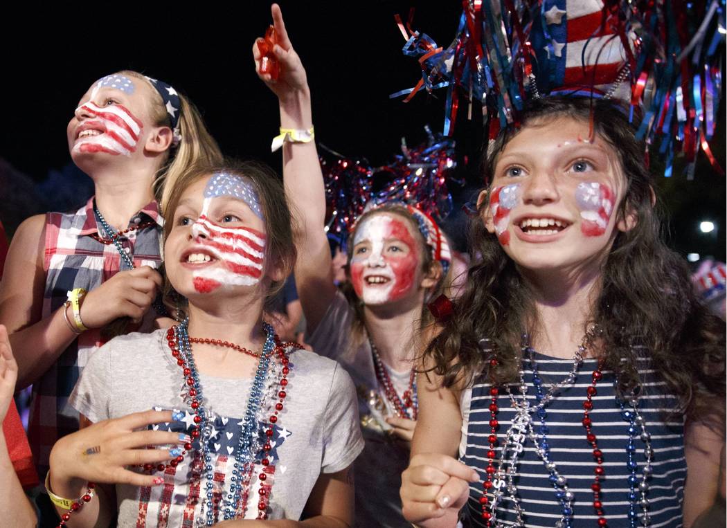 Children sing along during a rehearsal for the annual Boston Pops Fireworks Spectacular on the Esplanade, Monday, July 3, 2017, in Boston. (Michael Dwyer/AP)
