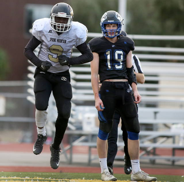 Spring Mountain's Quarterback, Eric Brooks (3), celebrates after completing a touchdown during the class 1A state football final neutral playoff game against Pahranagat Valley at Clark High School ...
