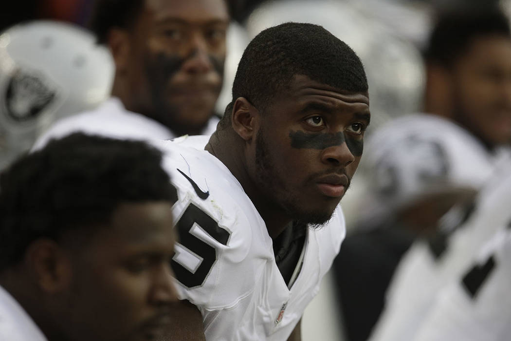 Oakland Raiders defensive end Jihad Ward sits on the bench during an NFL football game against the Denver Broncos, Sunday, Jan. 1, 2017, in Denver. (AP Photo/Joe Mahoney)