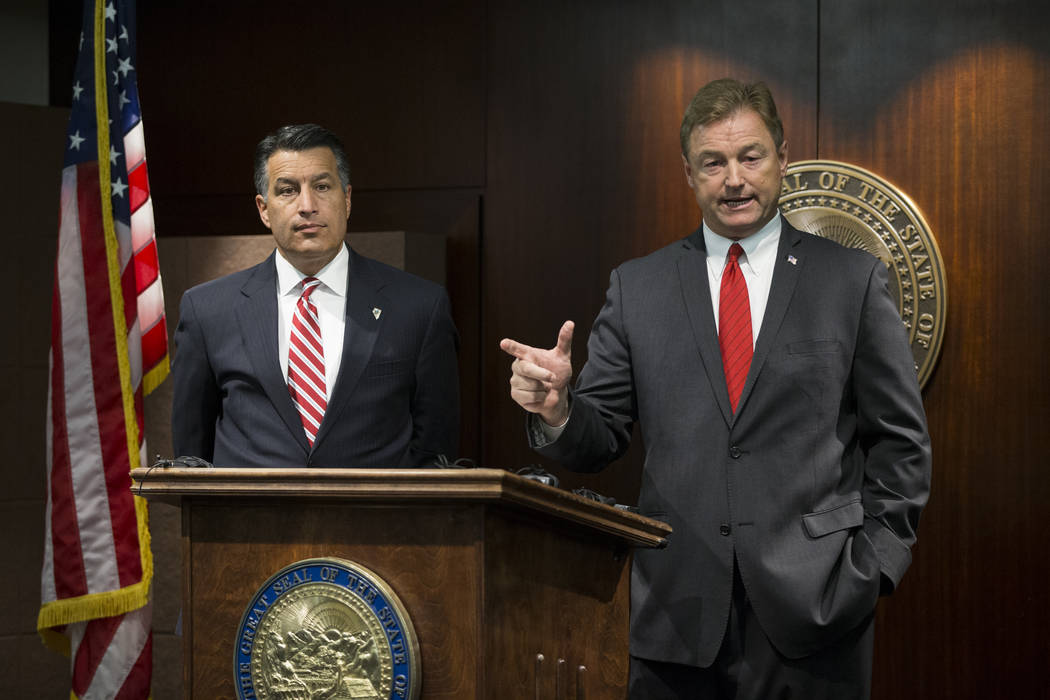 Nevada Gov. Brian Sandoval, left, and Sen. Dean Heller during a press conference where the senator announced he will vote no on the proposed GOP healthcare bill at the Sawyer Building on Friday, J ...