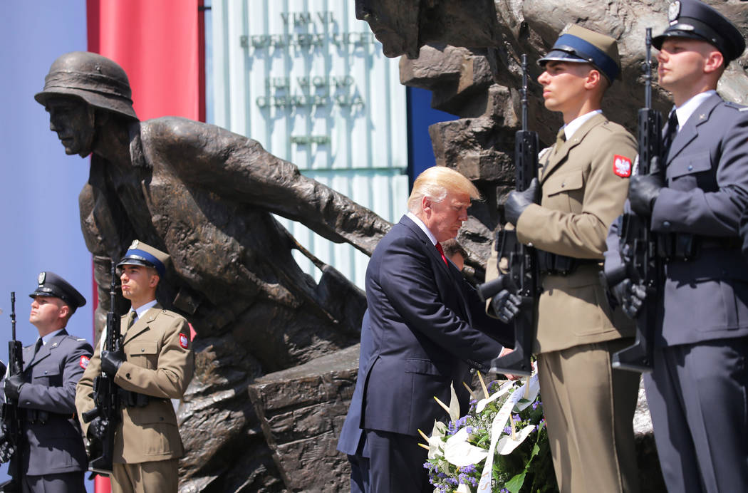 U.S. President Donald Trump lays a wreath at Warsaw Uprising Monument at Krasinski Square, in Warsaw, Poland July 6, 2017. REUTERS/Carlos Barria