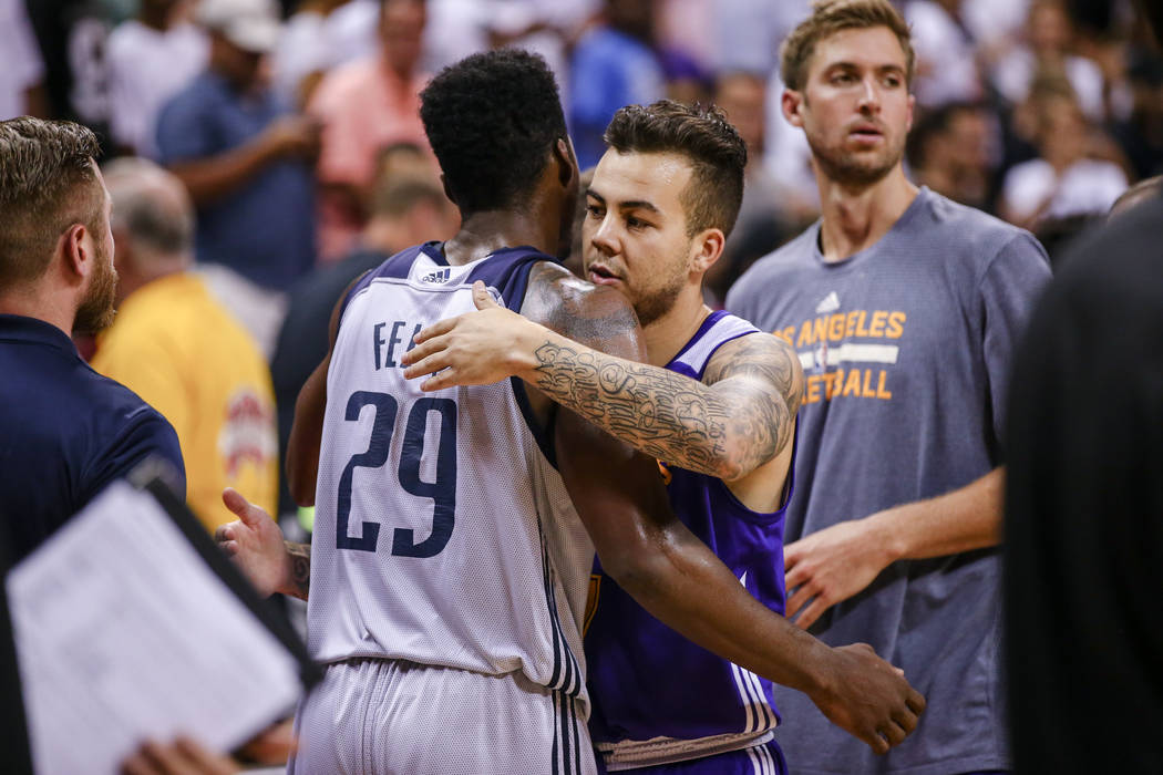 Dallas Mavericks forward Carrick Felix embraces Los Angeles Lakers guard Gabe York during the NBA Summer League semifinal game at Thomas and Mack Center on Sunday, July 16, 2017, in Las Vegas. Mor ...