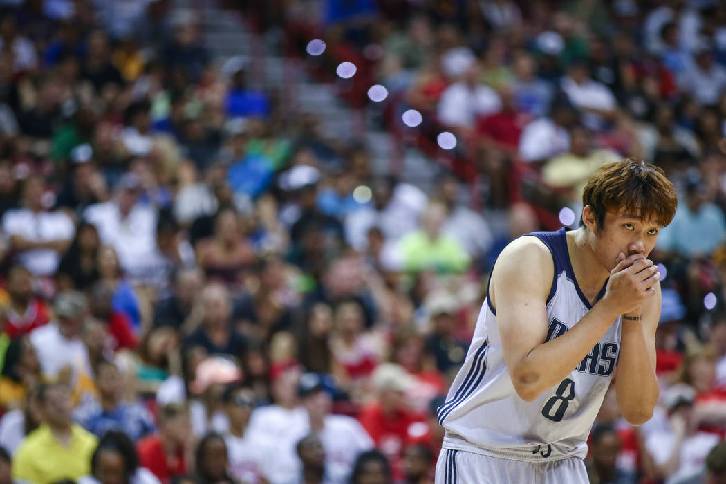Dallas Mavericks forward Ding Yanyuhang warms up his hands during the NBA Summer League semifinal game at Thomas and Mack Center on Sunday, July 16, 2017, in Las Vegas. Morgan Lieberman Las Vegas ...