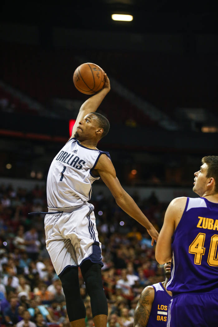Dallas Mavericks guard Dennis Smith Jr. with a dunk against Los Angeles Lakers center Ivica Zubac during the NBA Summer League semifinal game at Thomas and Mack Center on Sunday, July 16, 2017, in ...