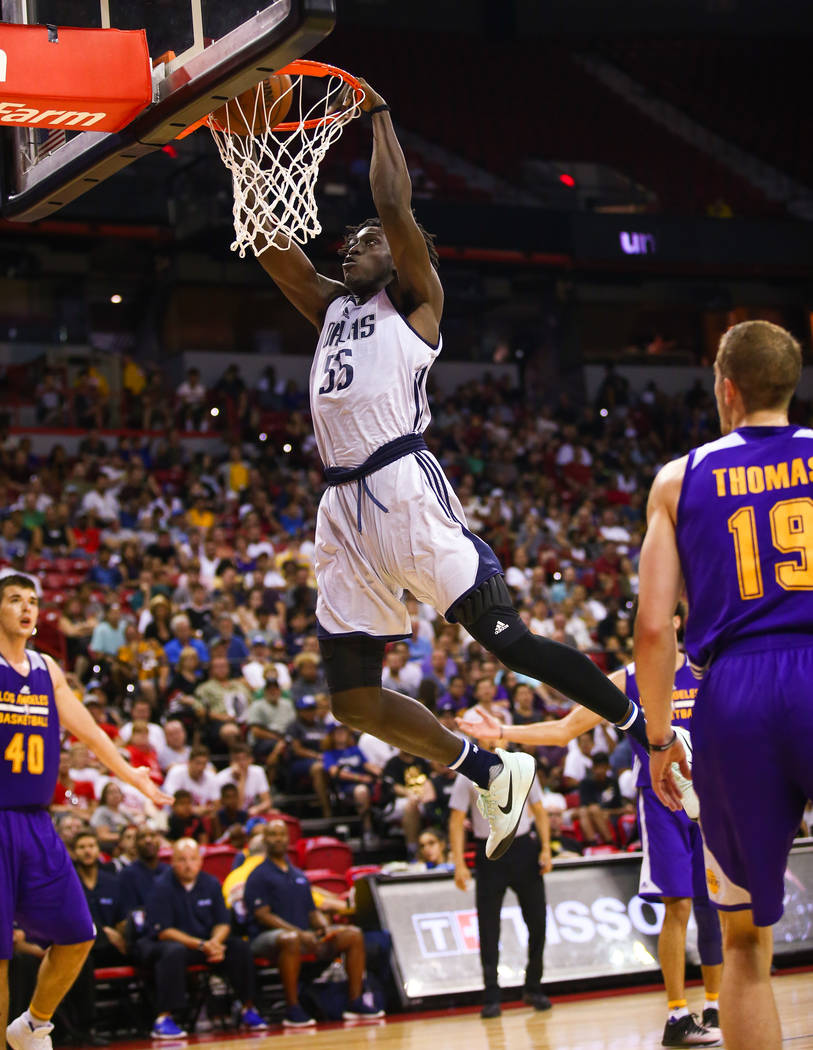 Dallas Mavericks forward Johnathan Motley goes for a slam dunk against Los Angeles Lakers guard Matt Thomas during the NBA Summer League semifinal game at Thomas and Mack Center on Sunday, July 16 ...