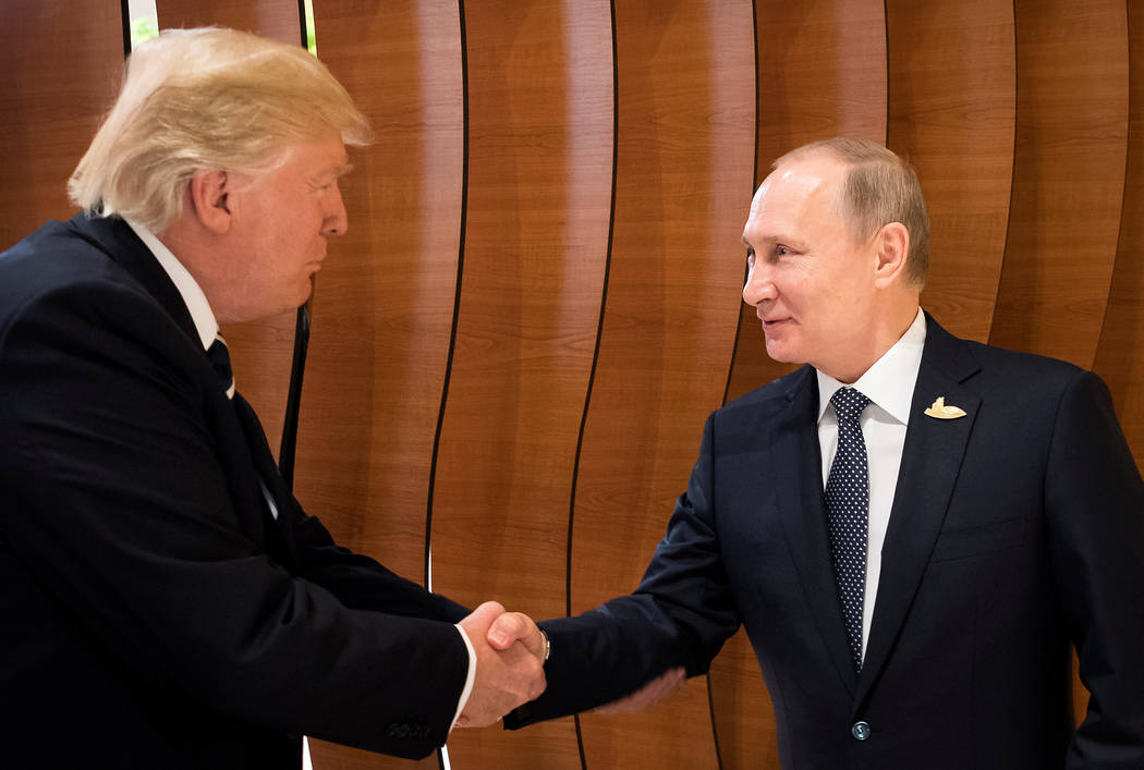 U.S. President Donald Trump and Russia's President Vladimir Putin shake hands during the G20 Summit in Hamburg, Germany in this still image taken from video, July 7, 2017. REUTERS/Steffen Kugler/C ...
