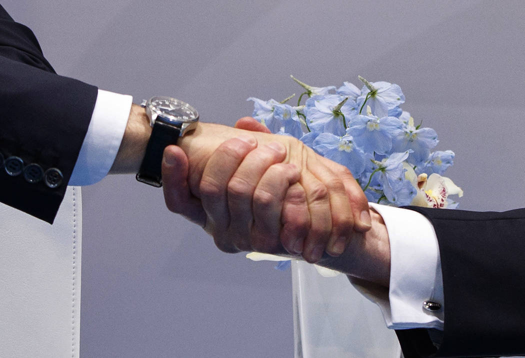 President Donald Trump shakes hands with Russian President Vladimir Putin at the G20 Summit, Friday, July 7, 2017, in Hamburg. (Evan Vucci/AP)