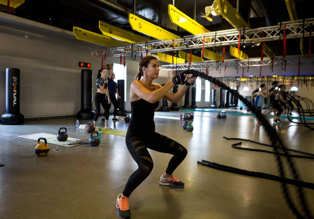 Jennifer Lee works out using battle ropes at TruFusion on Eastern Avenue in Las Vegas, Tuesday, July 10, 2017.(Elizabeth Brumley/Las Vegas Review-Journal)