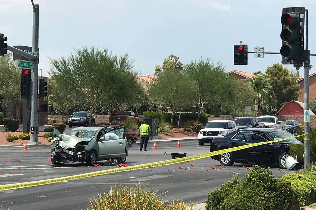 Las Vegas police work at the scene of a fatal accident Saturday at the intersection of Craig Road and Tenaya Way in the northwest valley. Blake Apgar Las Vegas Review-Journal
