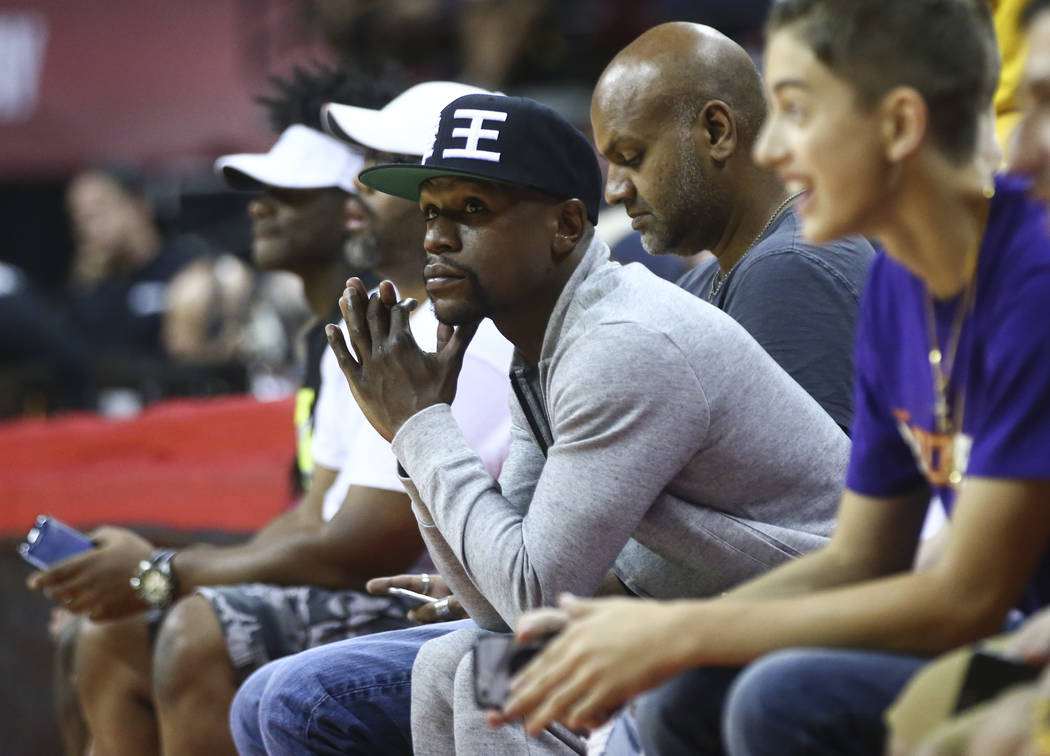 Floyd Mayweather takes in the action as the Cleveland Cavaliers play the Milwaukee Bucks during a basketball game at the NBA Summer League at the Thomas & Mack Center in Las Vegas on Friday, J ...