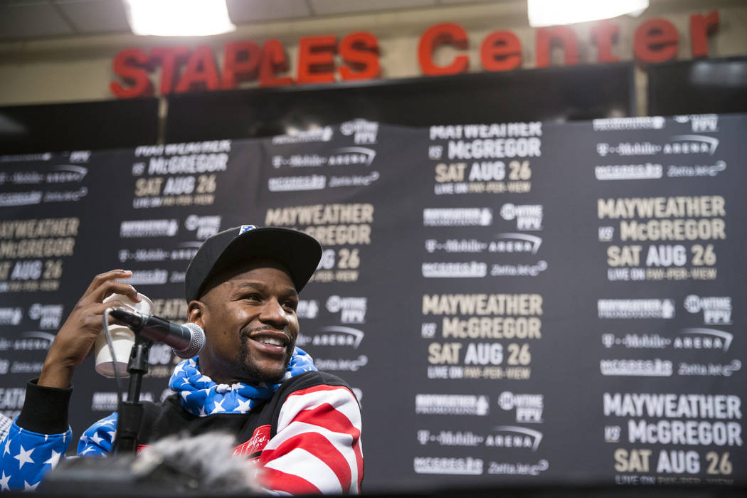 Boxer Floyd Mayweather Jr., during a world tour event stop to promote his upcoming fight against UFC fighter Conor McGregor, at Staples Center in Los Angeles, Calif., on Tuesday, July 11, 2017. Er ...