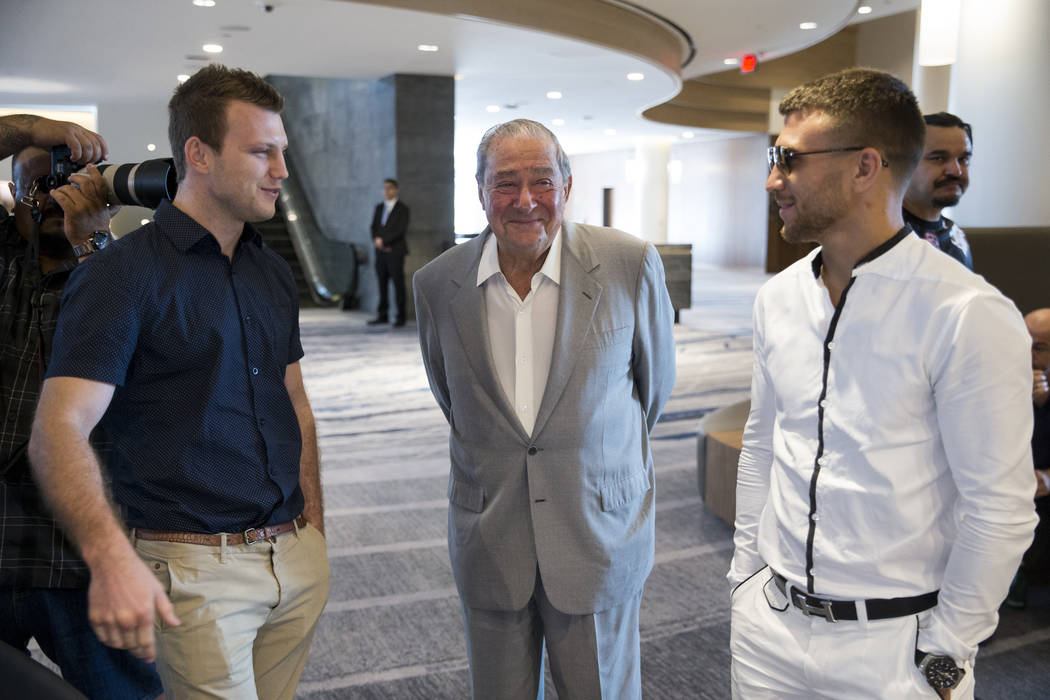 Boxers Jeff Horn, left, and Vasyl Lomachenko, right, meet as promoter Bob Arum look on during a press conference in Los Angeles, Calif., on Wednesday, July 12, 2017. Erik Verduzco Las Vegas Review ...