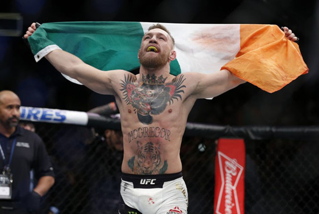 Conor McGregor celebrates after defeating Eddie Alvarez in their lightweight title bout during UFC 205 at Madison Square Garden. (Adam Hunger-USA TODAY Sports)