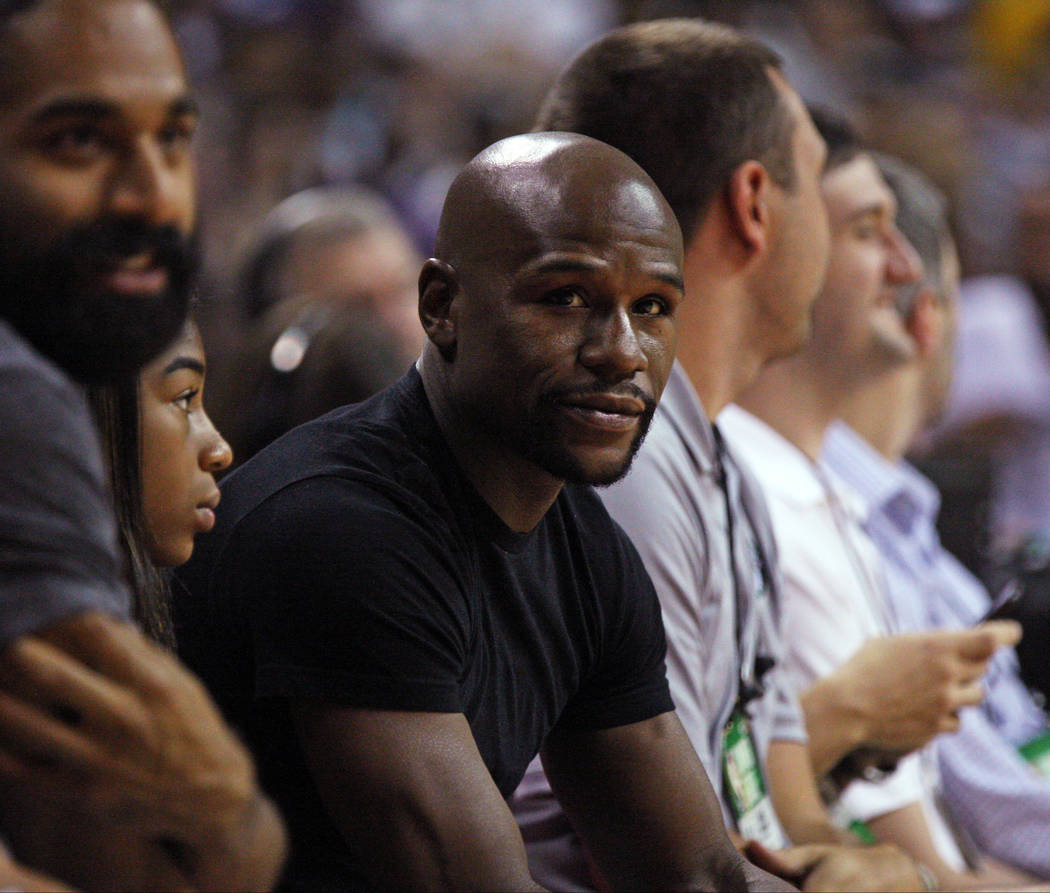 Boxing champion Floyd Mayweather watches the Boston Celtics and Los Angeles Lakers game during NBA Summer League at Thomas and Mack Center in Las Vegas on Saturday, July 8, 2017. Gabriella Benavid ...