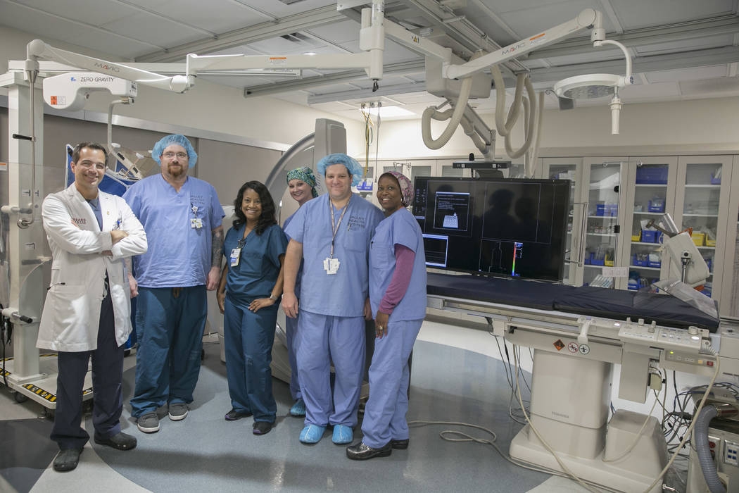 The Catheterization Laboratory "Cath Lab" team of Spring Valley Hospital Medical Center, Interventional Cardiologist Dr. Georges Tanbe, from left, Cardiac Cath Lab Tech Richard Wall, Cath Lab Clin ...