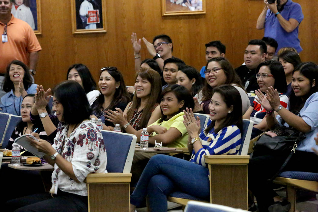 Teachers from the Philippines applaud after being welcomed to the Clark County School District, during orientation of over 70 Filipino applicants brought in to fill a shortage of special education ...