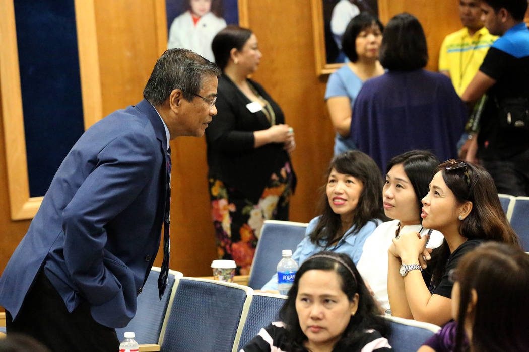 Bernie Benito, from left, chairman of the National Federation of Filipino American Associations, speaks with several of the 82 teachers on Tuesday, July 11, 2017, that the Clark County School Dist ...