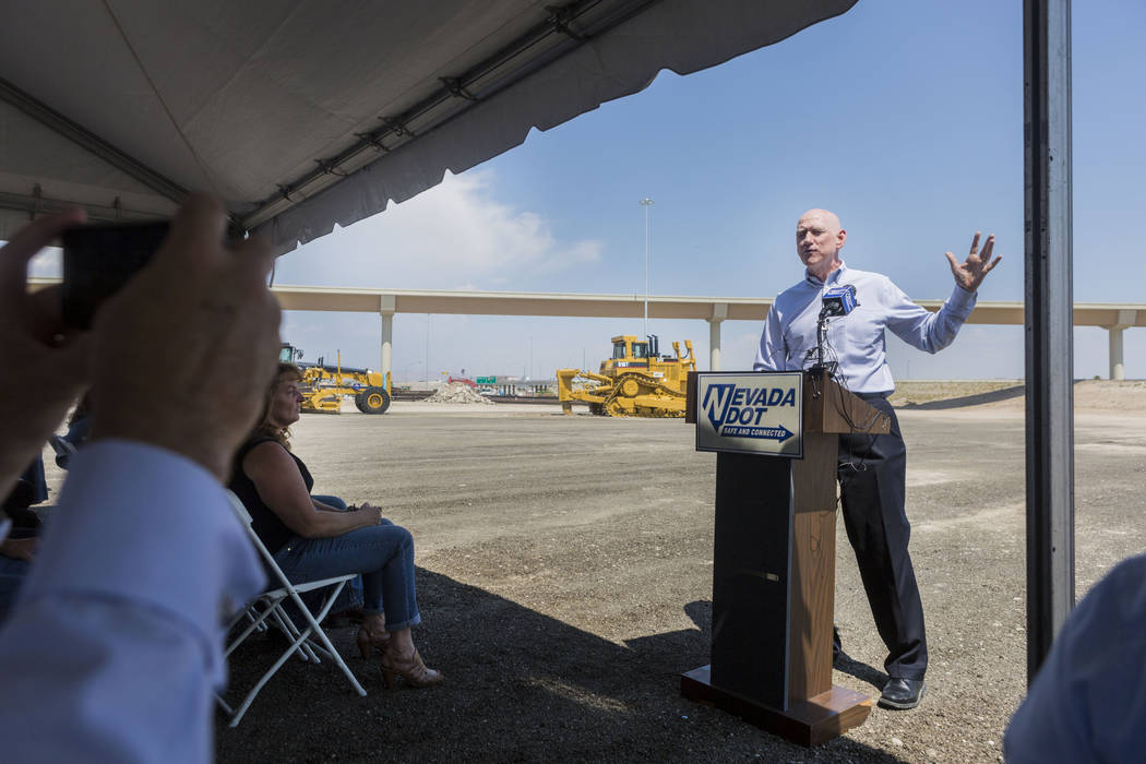 Larry Brown, Clark County commissioner and chairman Regional Transportation Commission of Southern Nevada chairman, celebrates the opening of the Centennial Bowl flyover bridge linking westbound 2 ...