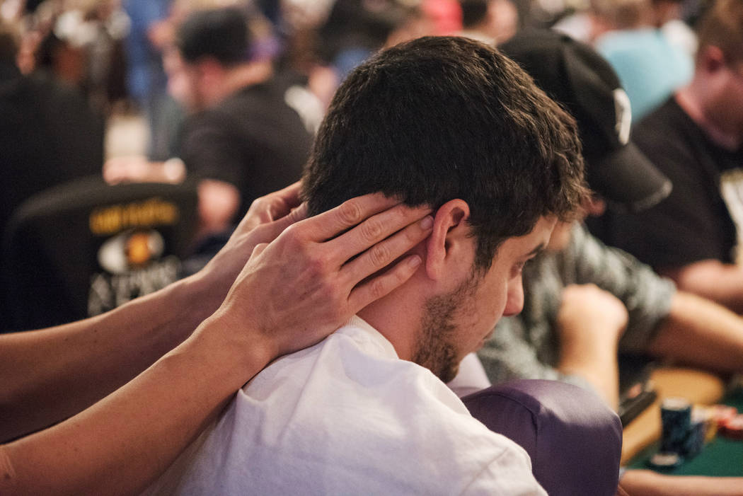 Professional Massage employee Amanda Pasco massages Atlanta resident Harley Thrower at WSOP on Wednesday, July 12, 2017, at Rio Convention Center in Las Vegas. Morgan Lieberman Las Vegas Review-Jo ...