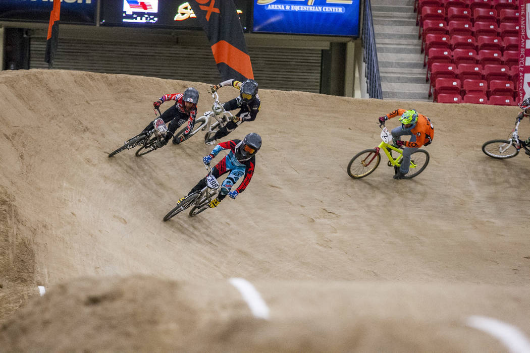 BMX riders come around a turn during the USA BMX 2017 Las Vegas Nationals at South Point Arena on Sunday, July 16, 2017. Patrick Connolly Las Vegas Review-Journal @PConnPie