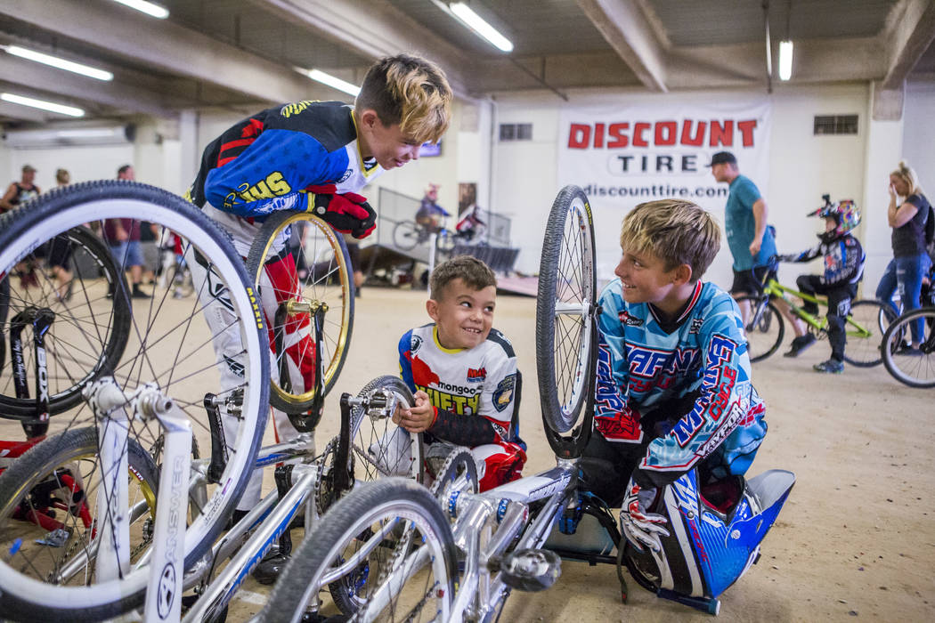 Troy Griffin, 11, from left, Reese Griffin, 7, and Tyler Cowell, 11, of Gilroy, Calif, hang out in between races at the USA BMX 2017 Las Vegas Nationals at South Point Arena on Sunday, July 16, 20 ...
