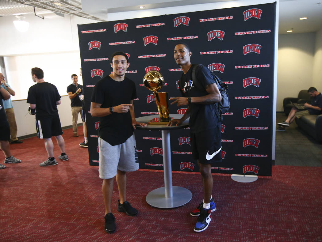 Golden State Warriors' Patrick McCaw, right, poses next to the Larry O'Brien Trophy with fellow former UNLV player Austin Starr in Mendenhall Center at UNLV in Las Vegas on Friday, July 14, 2017.  ...