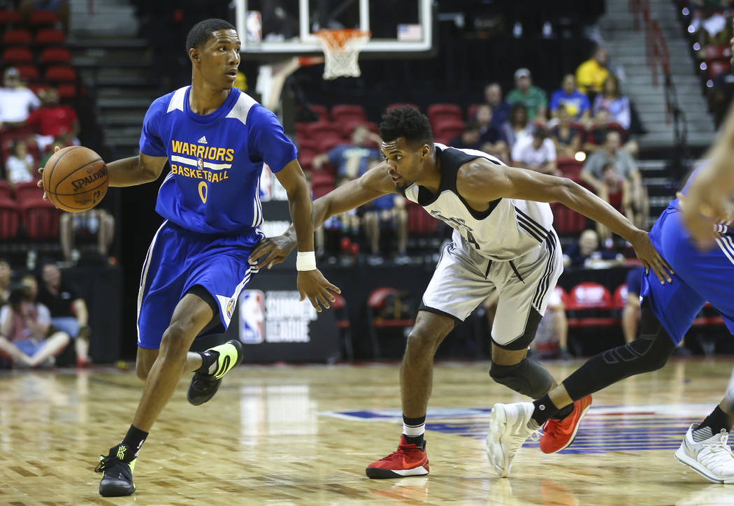 Golden State Warriors' Patrick McCaw (0) drives against Minnesota Timberwolves' Charles Cooke (44) during a basketball game at the NBA Summer League at the Thomas & Mack Center in Las Vegas on ...