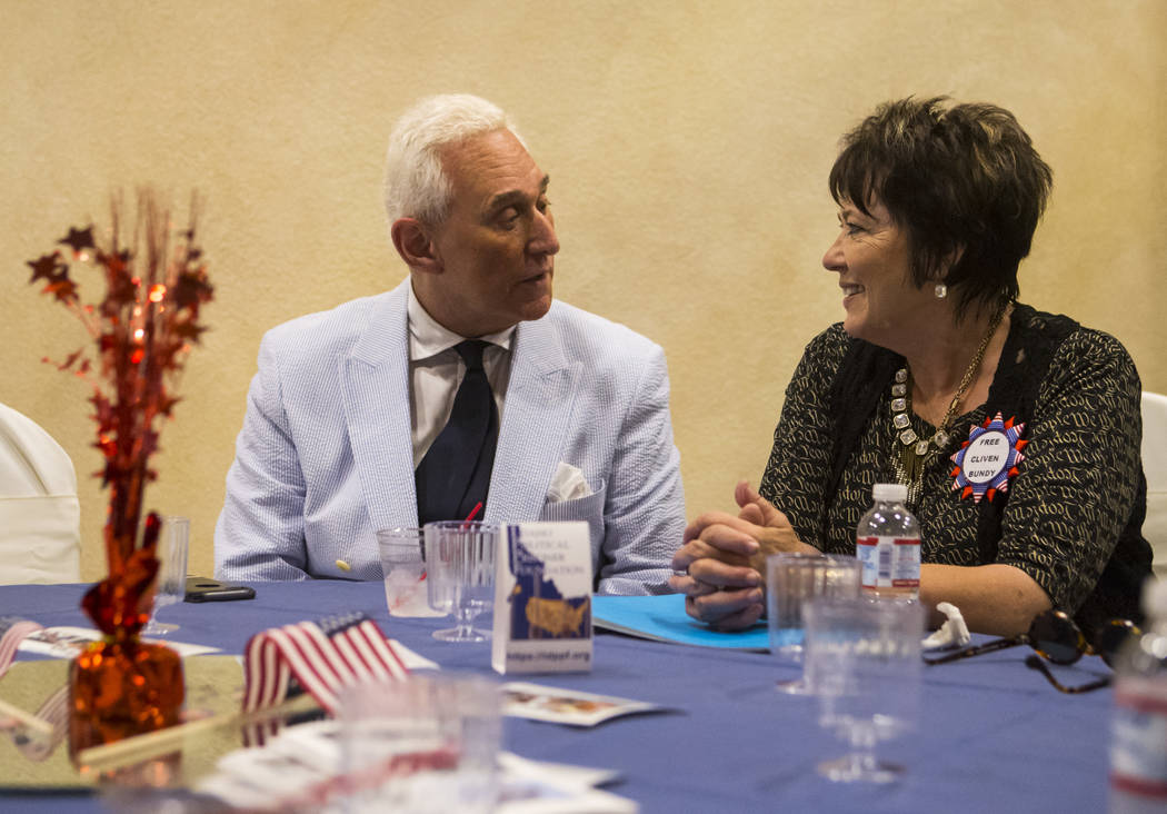 Political consultant Roger Stone, left, talks with Carol Bundy, wife of Cliven Bundy, at a fundraising event in support of the Bundy family at Rainbow Gardens in Las Vegas on Saturday, July 15, 20 ...