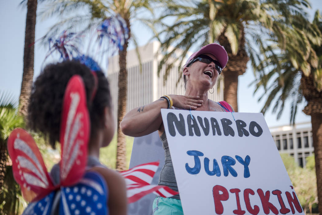 Oregon resident Mona Cleveland, chants in front of her daughter, Hanna, at a rally to support defendants in the Bundy standoff case at the Lloyd George U.S. Courthouse on Saturday, July 15, 2017, ...
