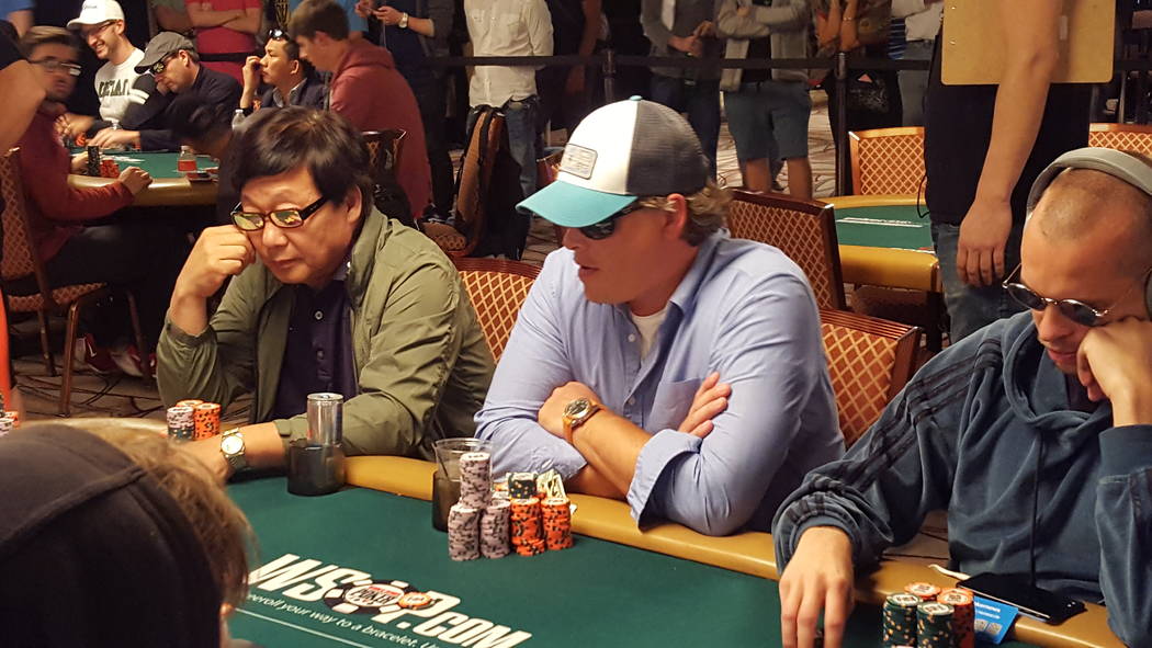 Joshua Horton, of Fort Payne, Alabama, center, is second in chips to start Day 6 of the World Series of Poker's $10,000 buy-in No-limit Texas Hold ’em World Championship at the Rio Convention Ce ...