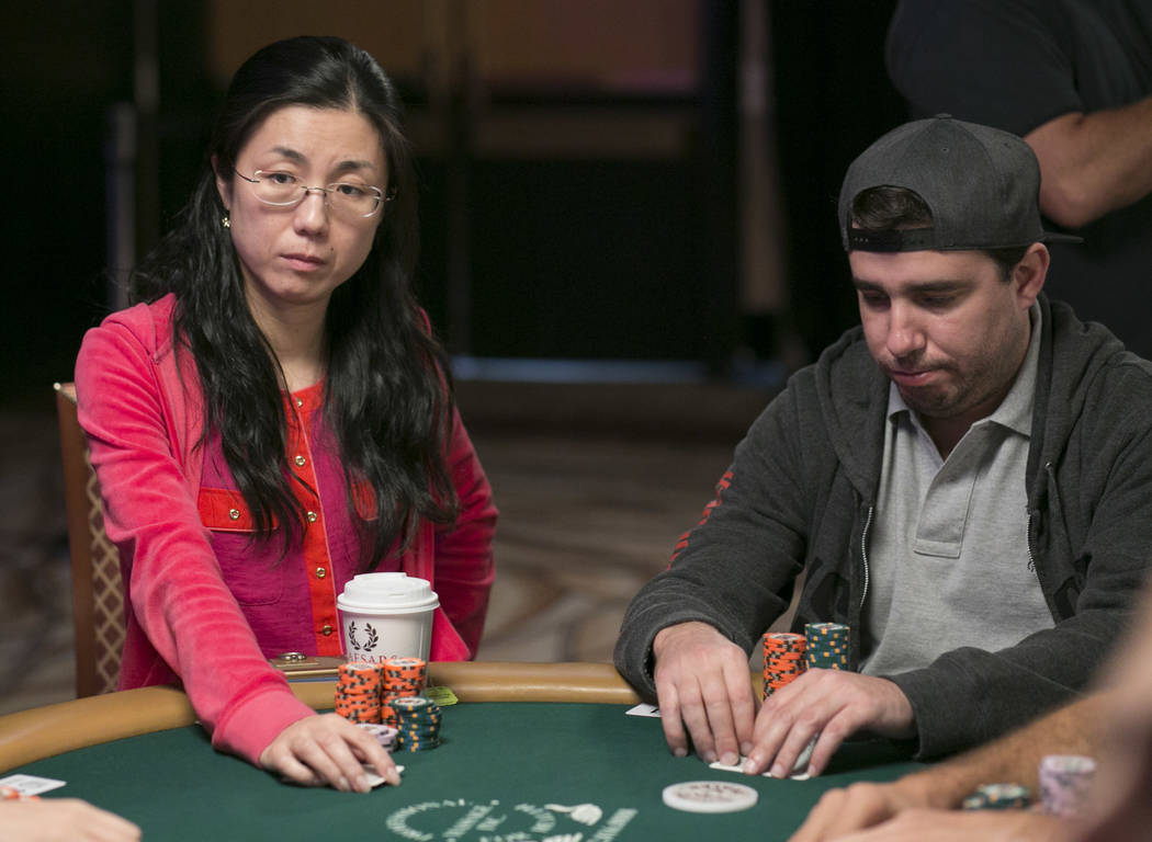 Yuan Li, left, waits for her turn during day five of the World Series of Poker at The Rio All-Suite Hotel and Casino in Las Vegas, Saturday, July 15, 2017. Li was the final female competitor and w ...