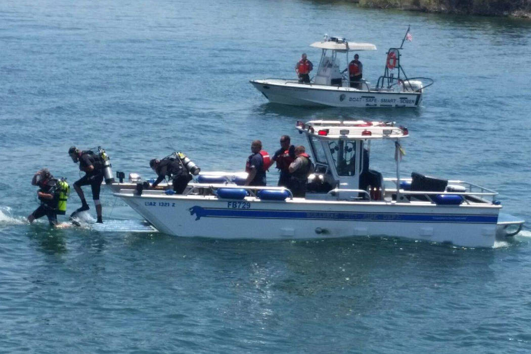 A dive boat and divers engage in body search and recovery at Lake Mohave Saturday, July 15, 2017. (Dave Hawkins)