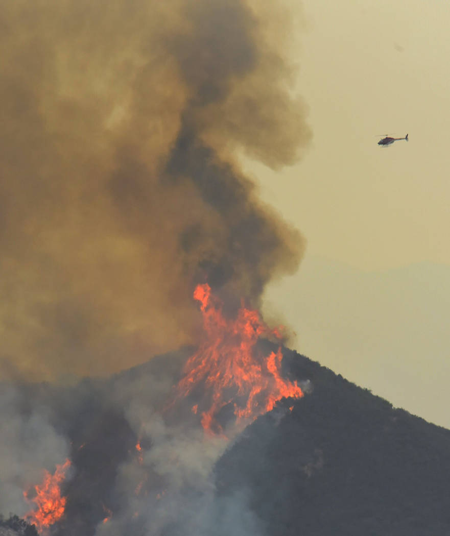 A reconnaissance helicopter surveys Whittier fire activity in Gato Canyon near Santa Barbara, California, U.S. July 15, 2017. (Mike Eliason/Santa Barbara County Fire Department/Handout via Reuters)