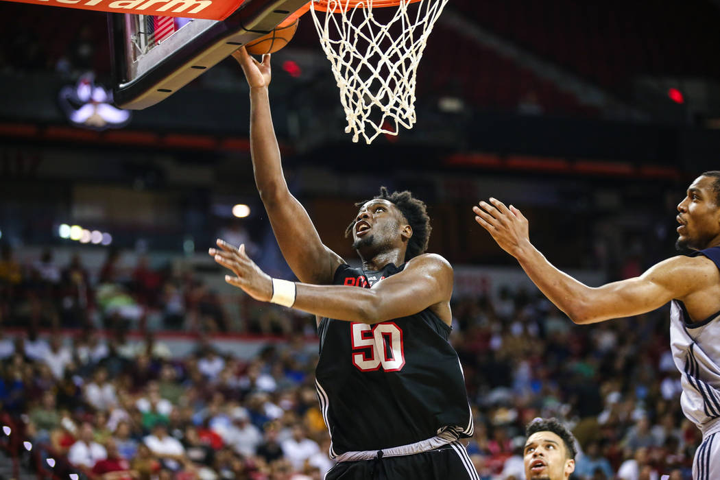 Portland Trail Blazers player Caleb Swanigan (50) goes up against Memphis Grizzlies player Vince Hunter during the NBA Summer League semifinal basketball game at Thomas and Mack Center on Sunday,  ...